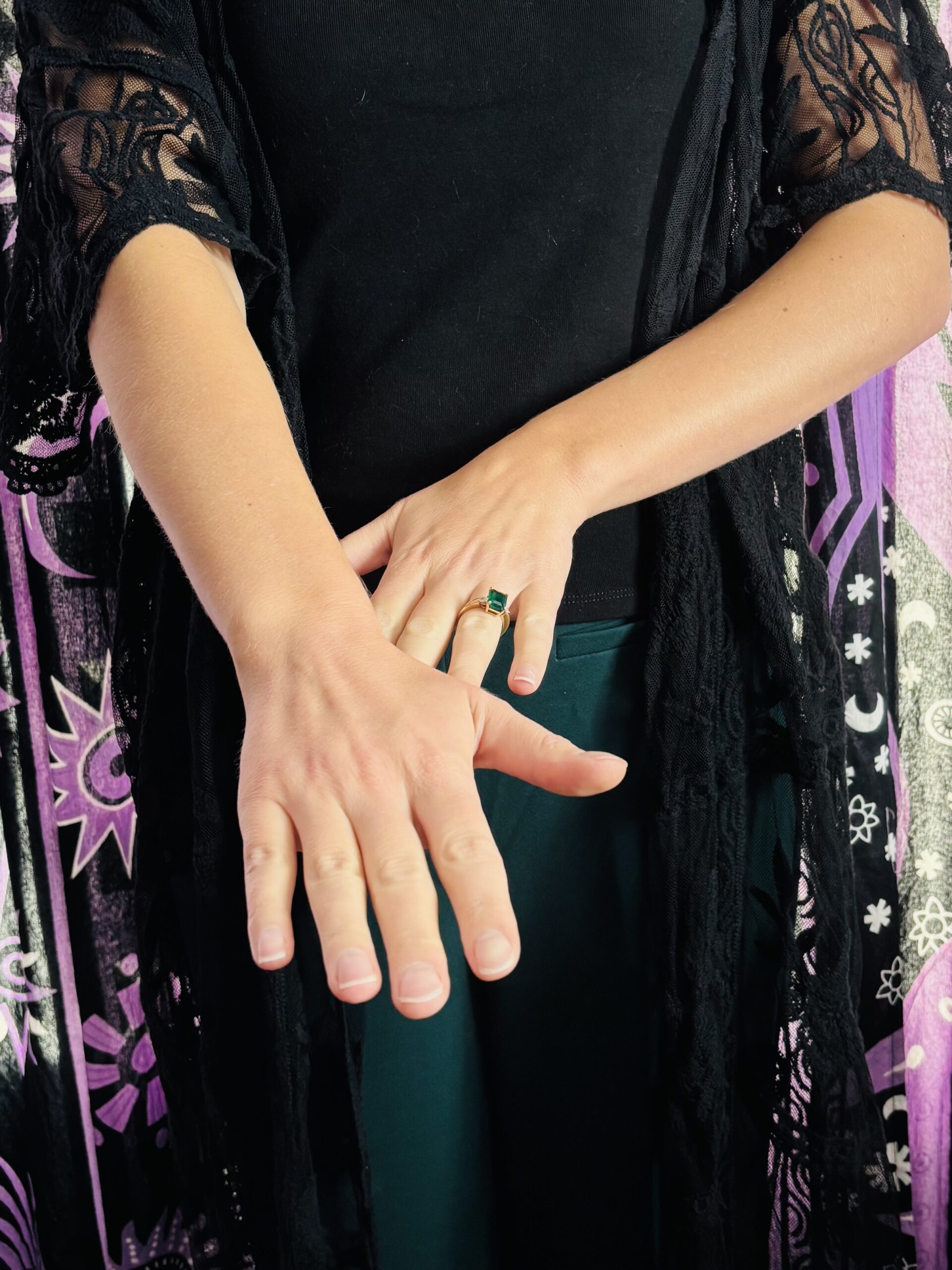 Close up hands held in hovered Reiki hand position