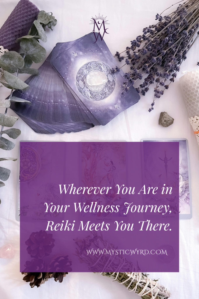 Dried herb bundles and tarot cards with the words "Wherever you are in your journey, Reiki meets you there."