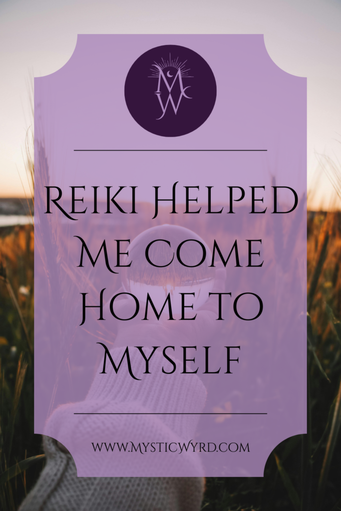Hands holding a crystal ball in front of a sunset and the text "Reiki helped me come home to myself"